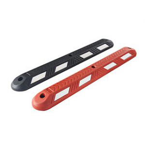 Black and red eco-type lane dividers made of recycled rubber without reflective glass road studs, used for traffic safety management.