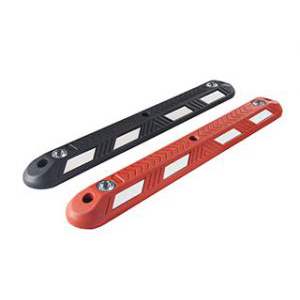 Black and red lane separators made of recycled rubber with or without reflective glass road studs, used for traffic safety management.