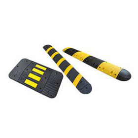 Rubber speed bumps and speed humps made of black and yellow vulcanized rubber, used for traffic calming purposes.
