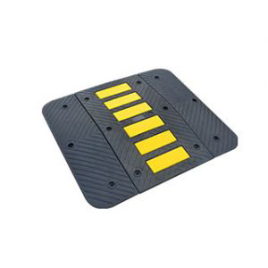 Speed hump of 900 mm type made of black vulcanized rubber with yellow reflective tapes as a parking lot security equipment.