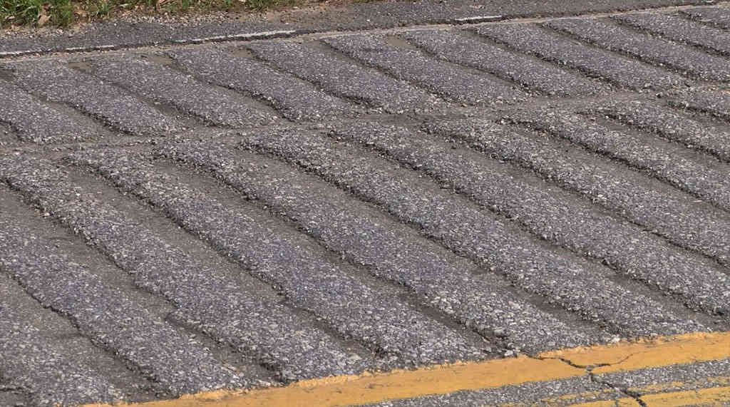 Formed rumble strips used to reduce speed.