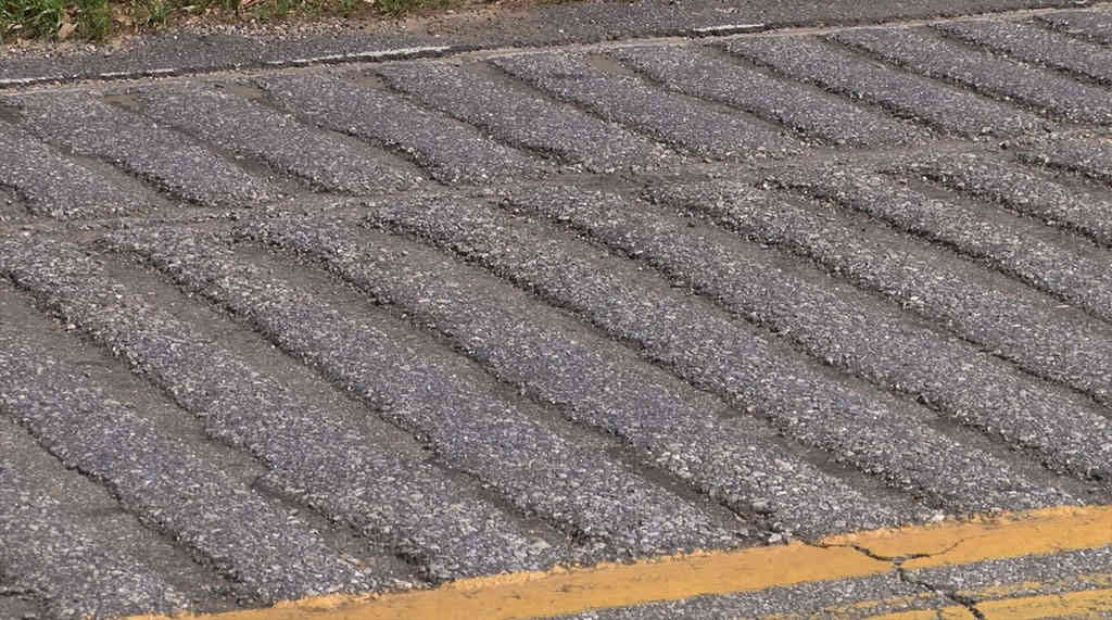 Formed rumble strips used to reduce speed.
