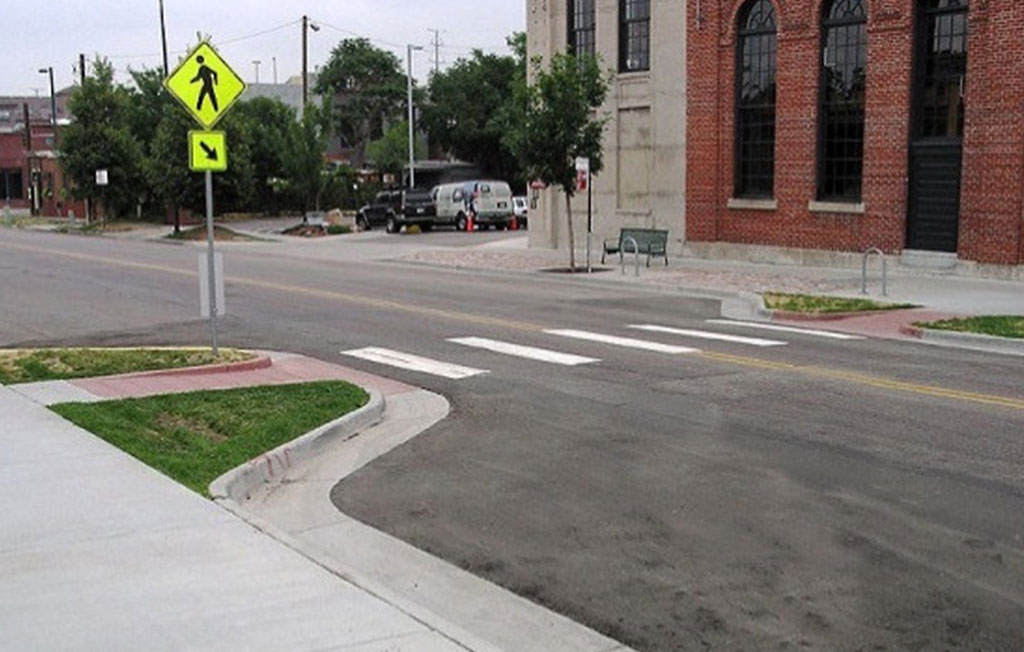 A kerb extension increases the width of the curbs to slow down vehicles.