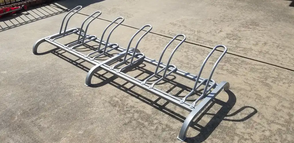 Steel cycle stands used for outdoor parking.