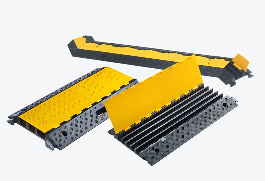 Different types of cable protectors also called cable ramps made of recycled rubber with yellow PE covers, used to protect cables