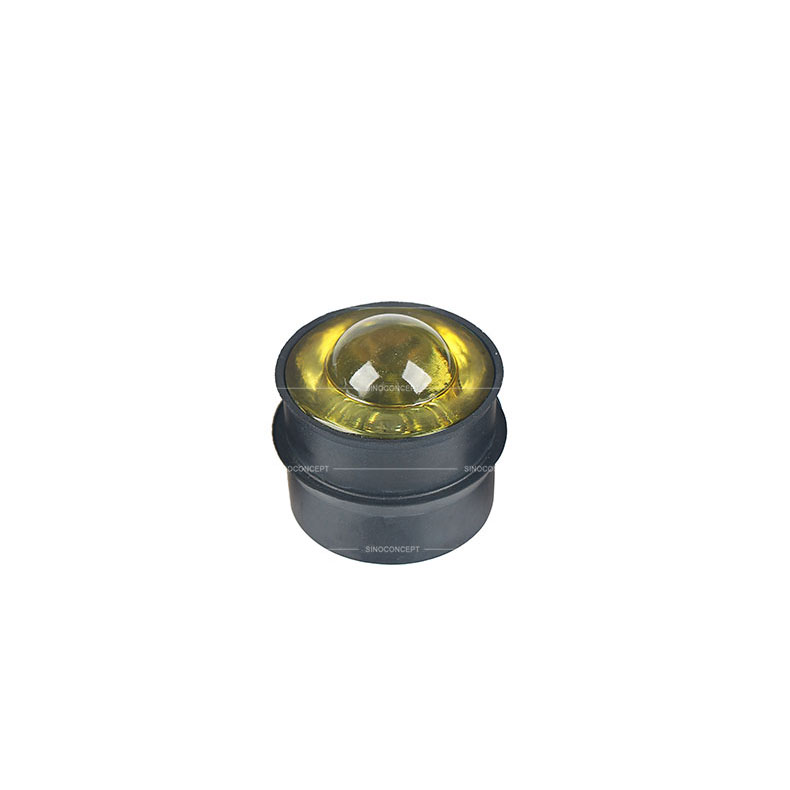 Yellow glass road reflector also called glass road stud made of glass and steel used on road as a traffic safety device