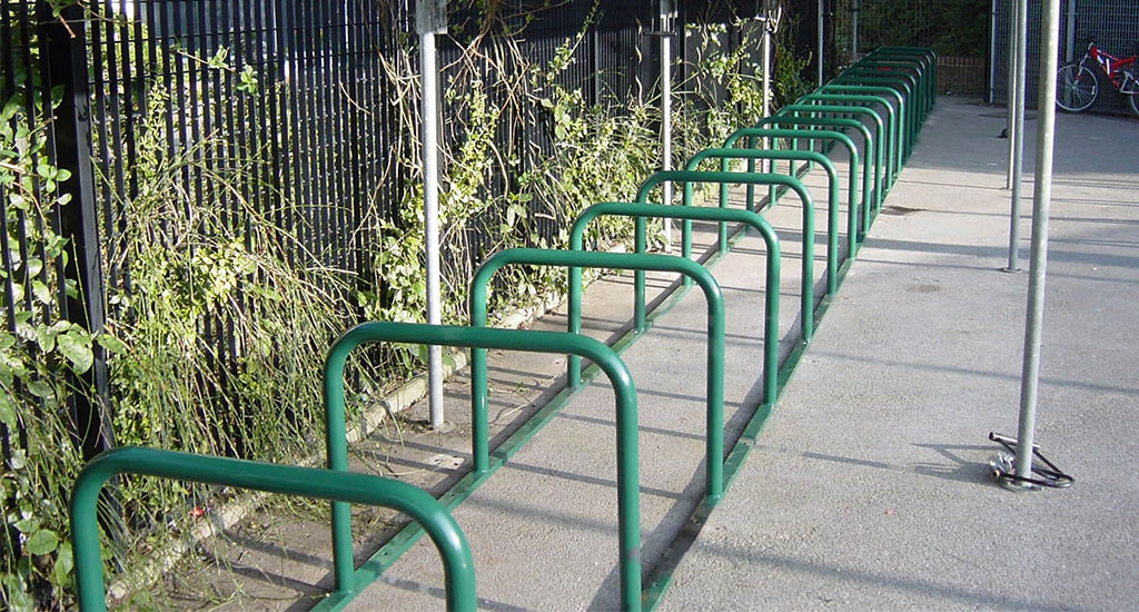 Green Sheffield bike racks for parking bicycles.