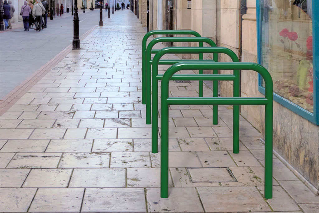 Green Sheffield bike racks for bicycle parking.