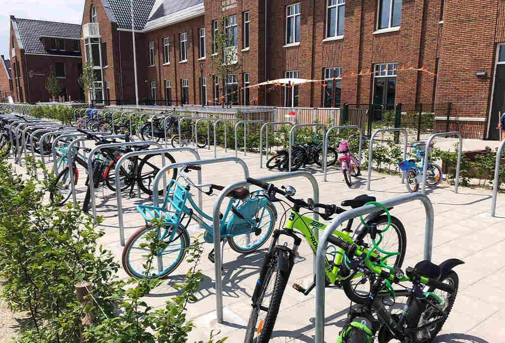 Sheffield bike stands installed on the ground for bike parking.