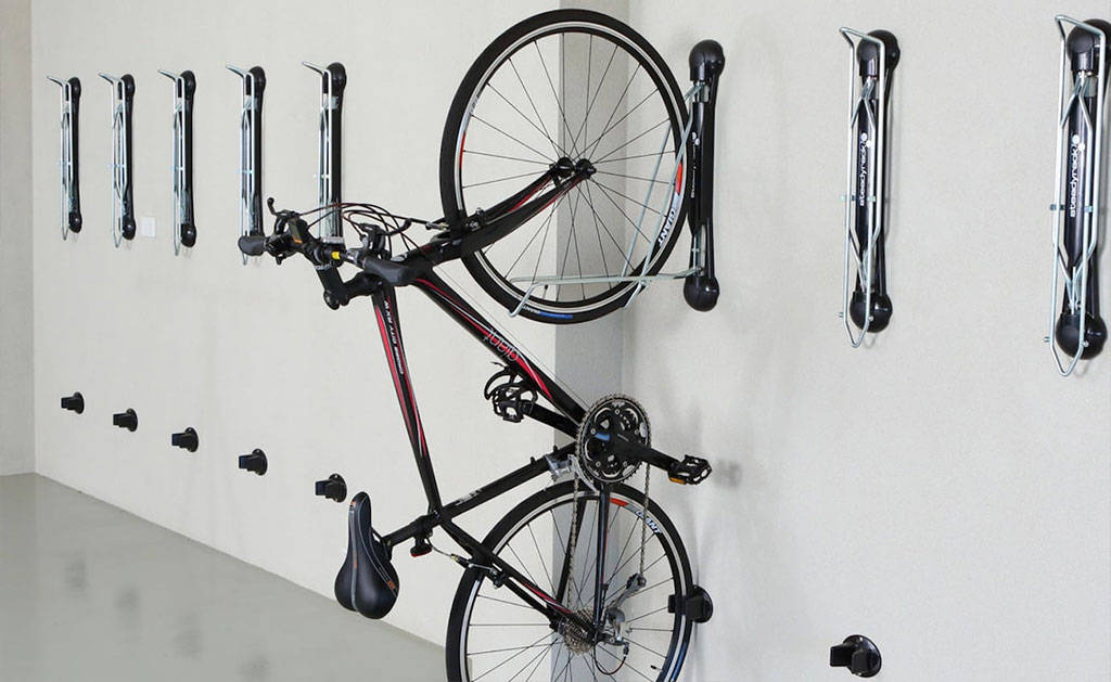 Wall-mounted cycle racks used to hold the bike securely on the wall.