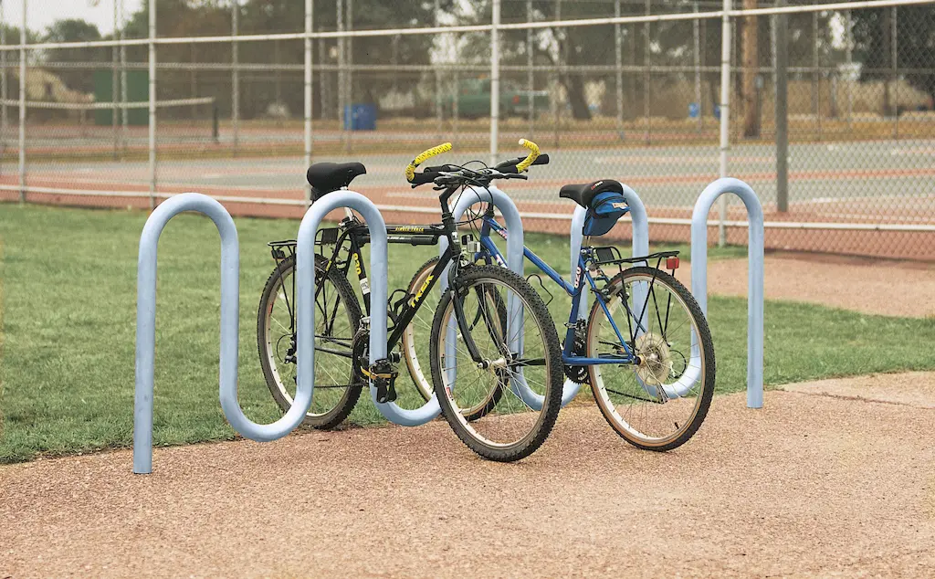 A steel wave bike rack providing secure parking for bicycles.