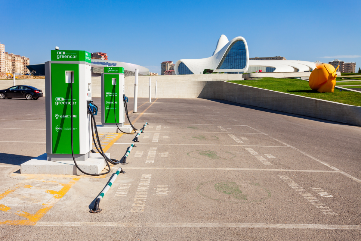 Wheel stops protecting EV charging station